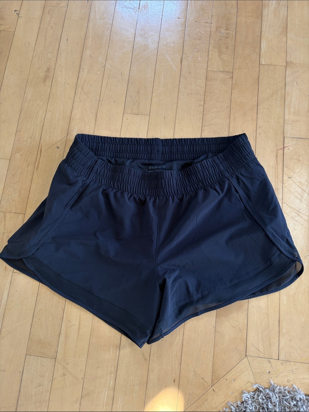 Athleta Black Mesh Racer Run 4”Short with Curved Hem